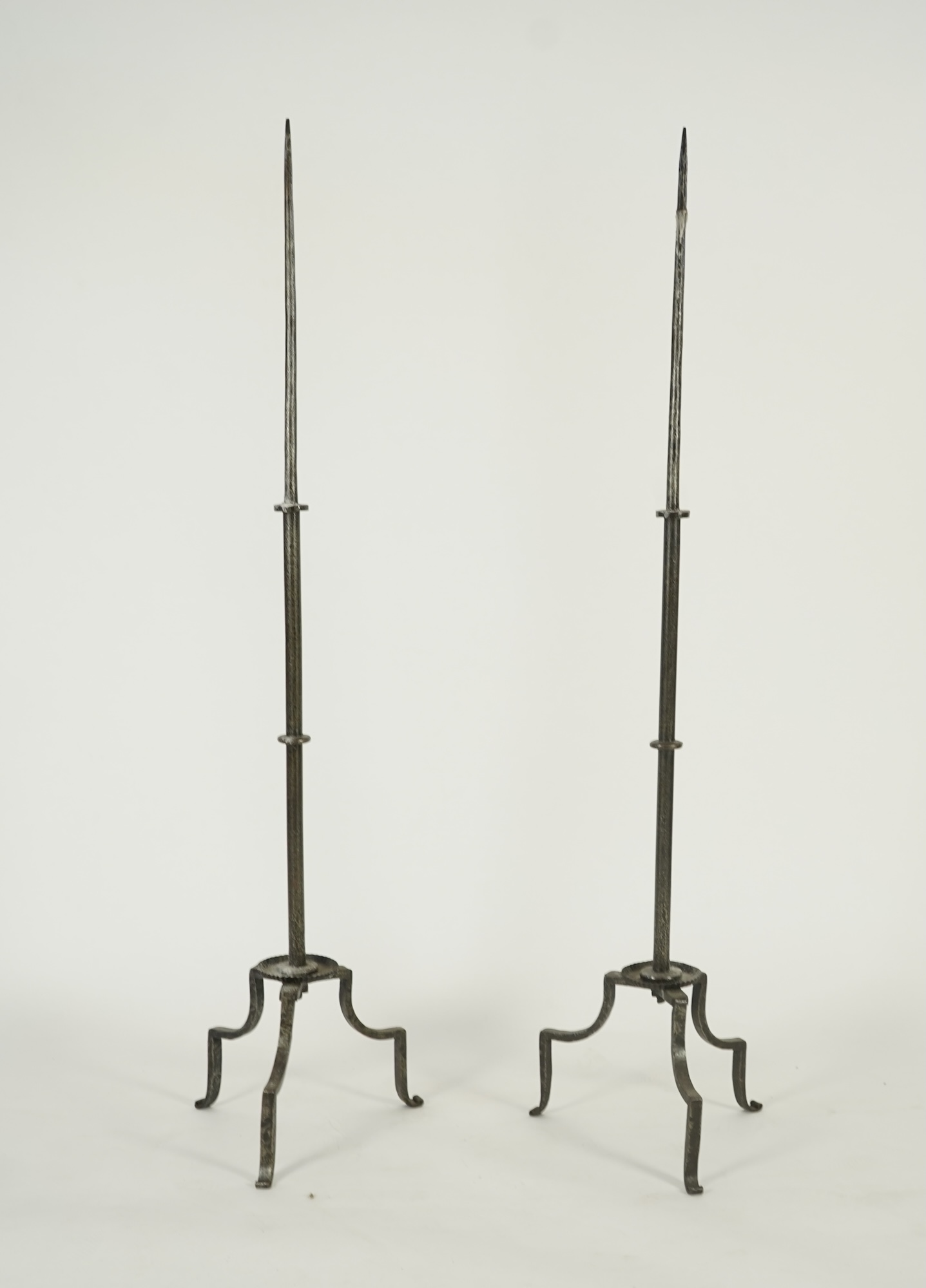 A pair of standing iron pricket candlesticks